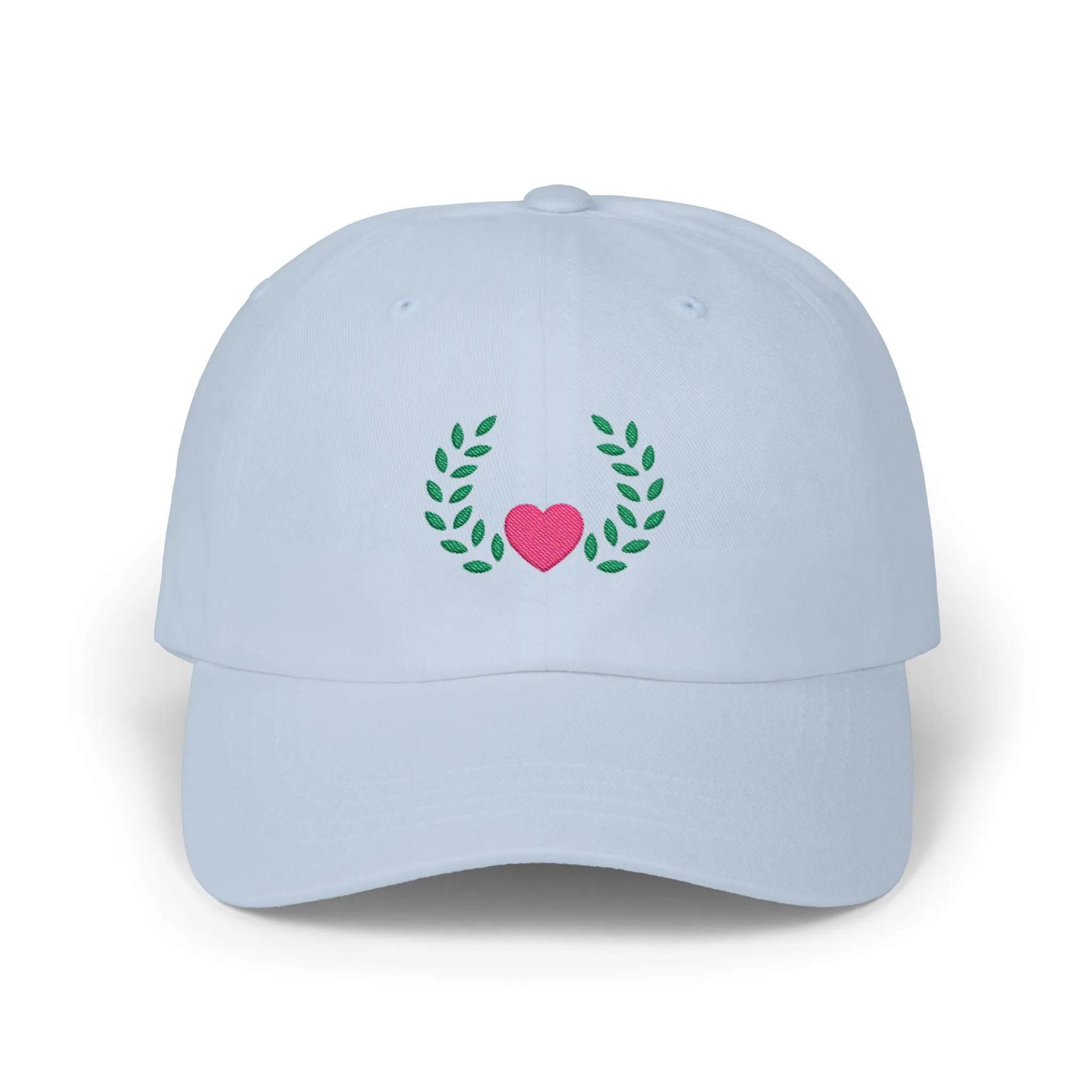 Light Blue heart and leaves baseball cap, front view with pink heart framed by green leaf branches