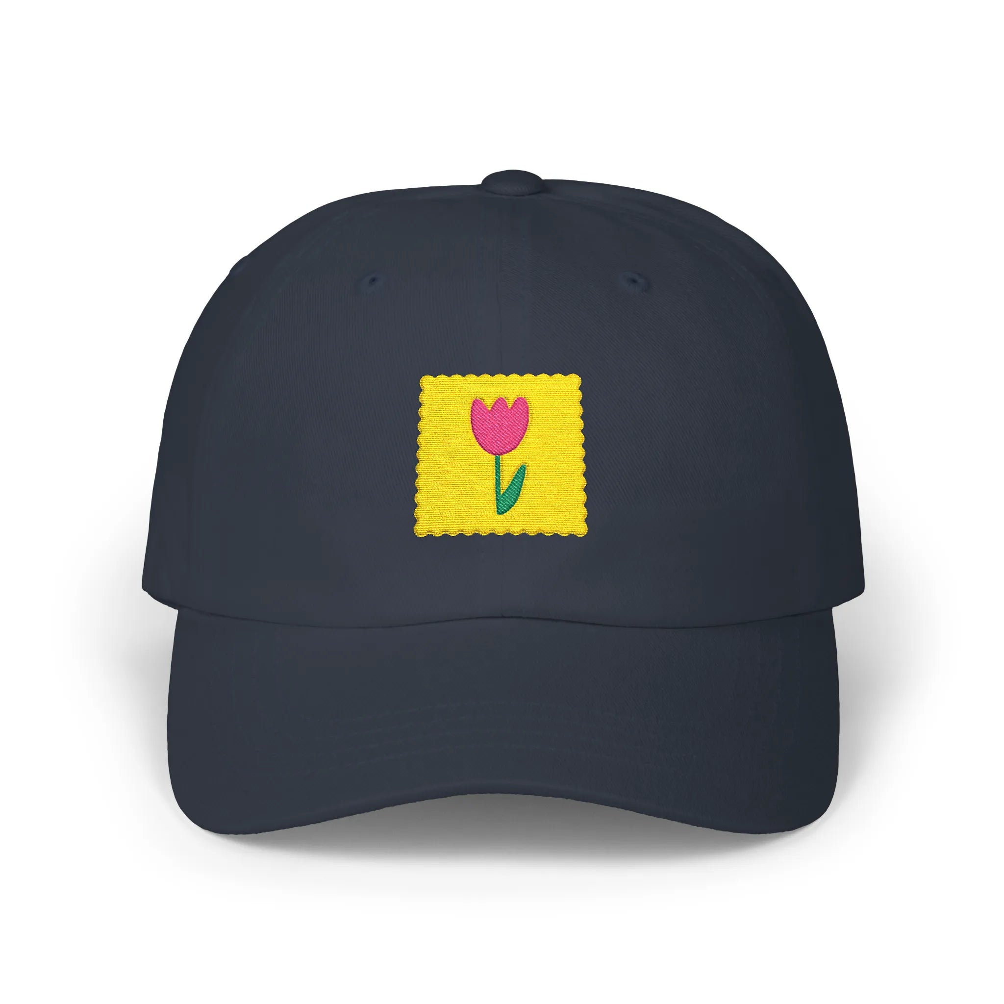 Navy flower stamp baseball cap, front view with yellow stamp patch and pink flower embroidery