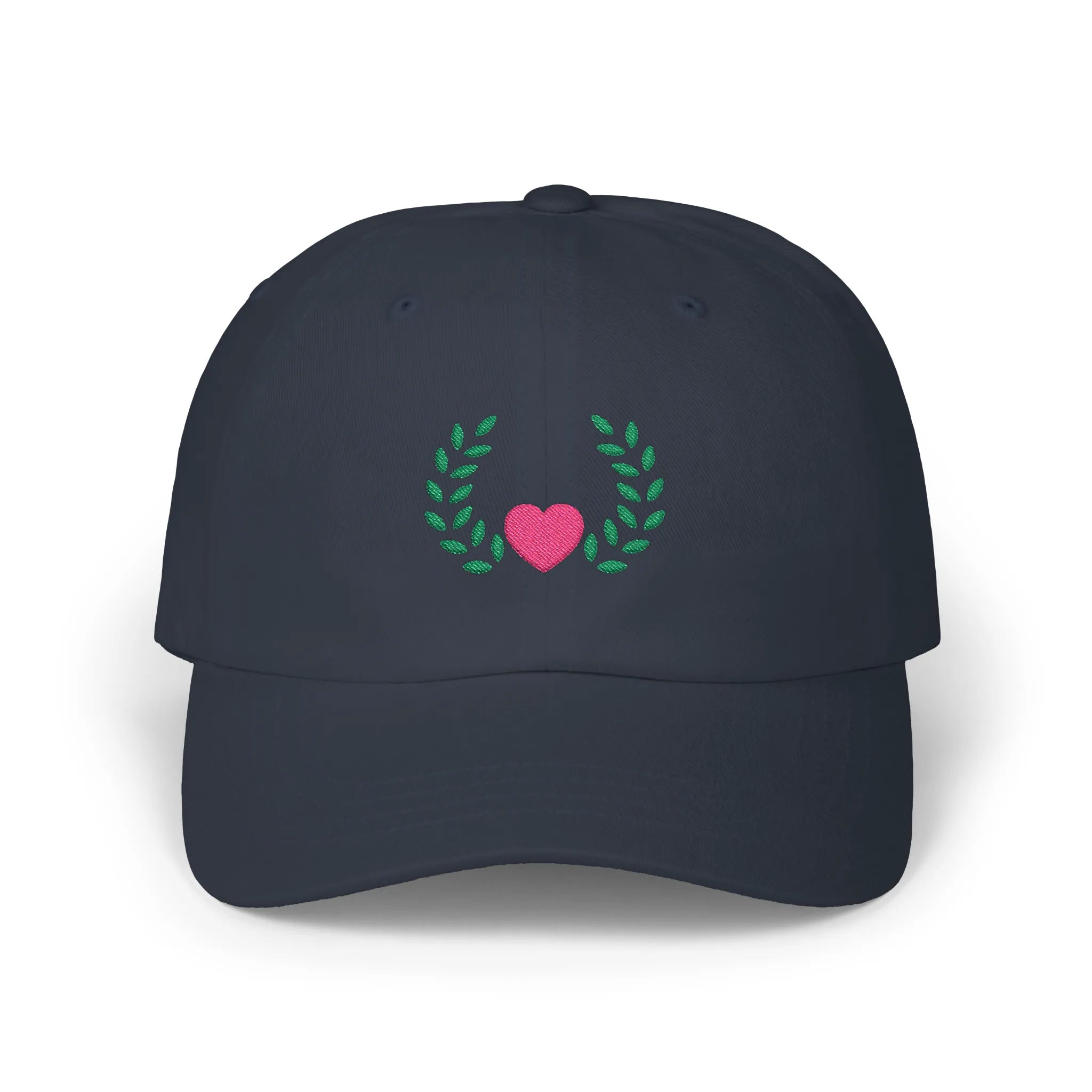 Navy heart and leaves baseball cap, front view with pink heart framed by green leaf branches