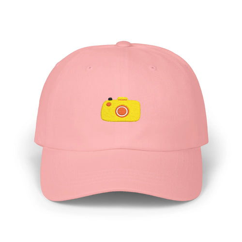Pink capture baseball cap, front view with yellow camera embroidery and orange lens