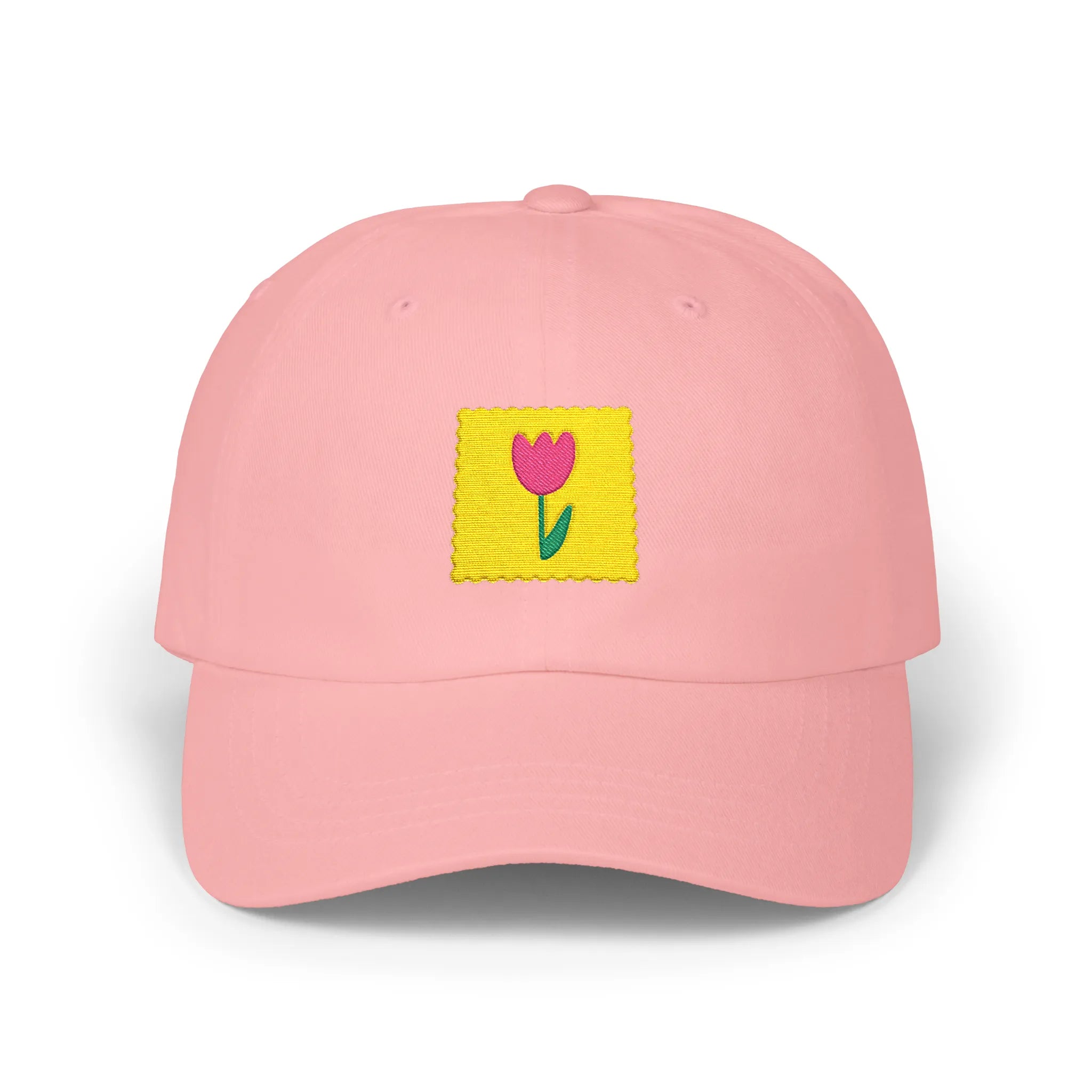 Pink flower stamp baseball cap, front view with yellow stamp patch and pink flower embroidery