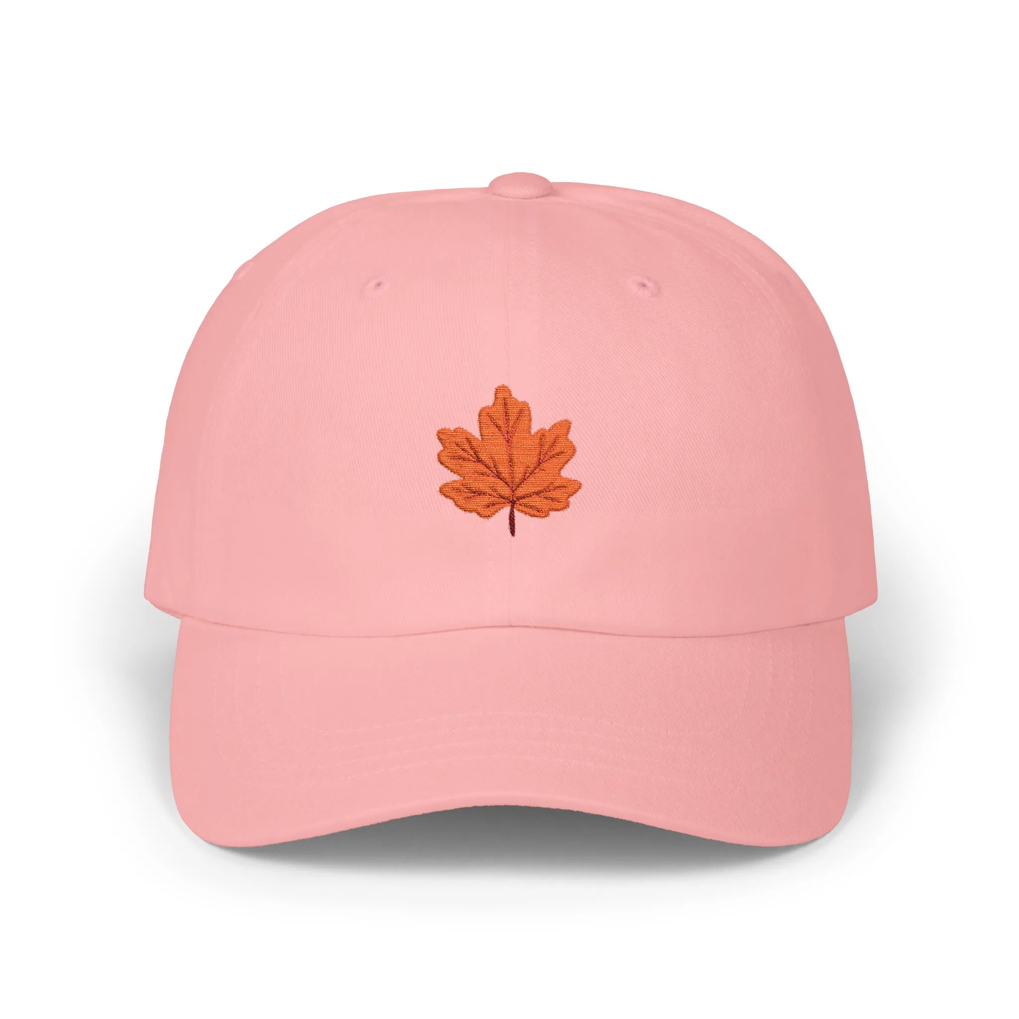 Pink maple leaf baseball cap, front view with orange maple leaf embroidery at center