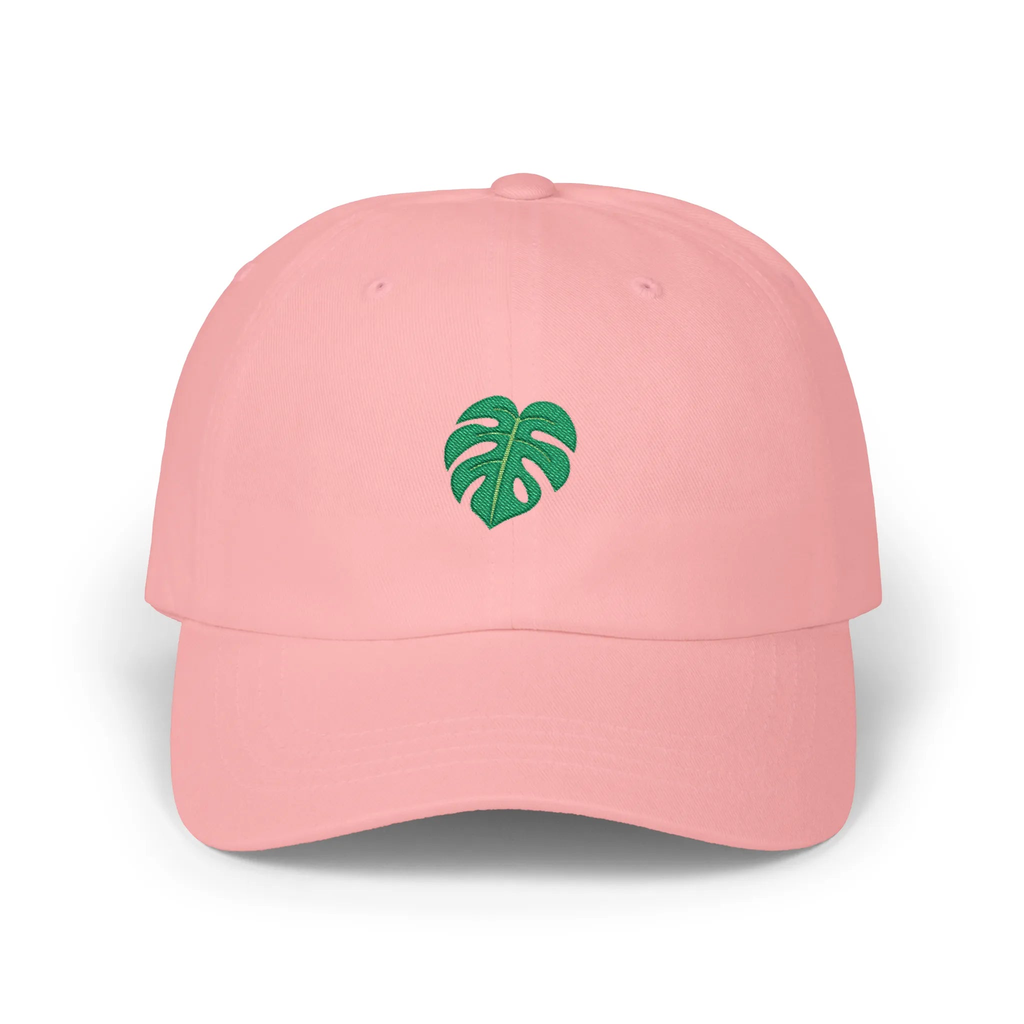 Pink monstera leaf baseball cap, front view with green monstera leaf embroidery