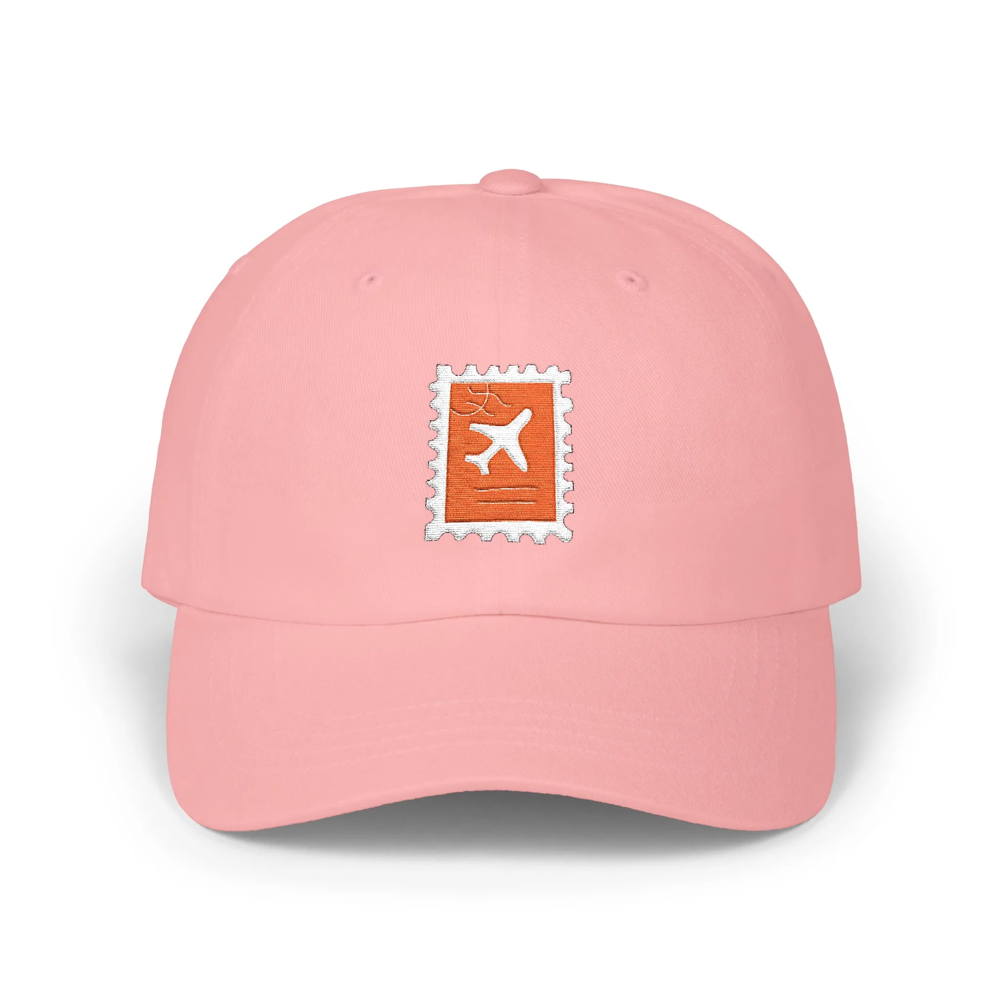 Pink plane ticket baseball cap, front view with orange stamp and airplane embroidery