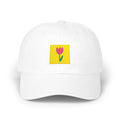 White flower stamp baseball cap, front view with yellow stamp patch and pink flower embroidery
