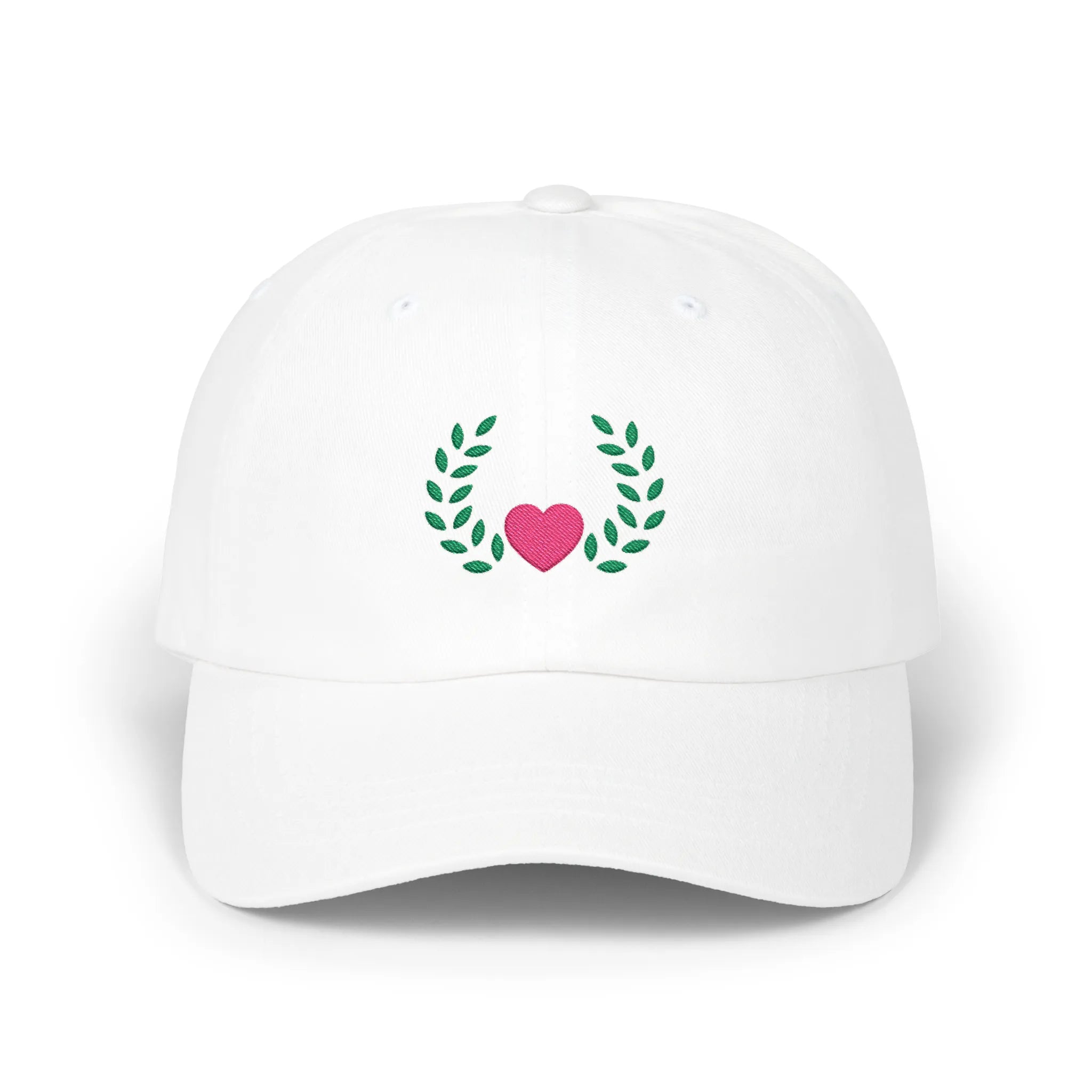 White heart and leaves baseball cap, front view with pink heart framed by green leaf branches